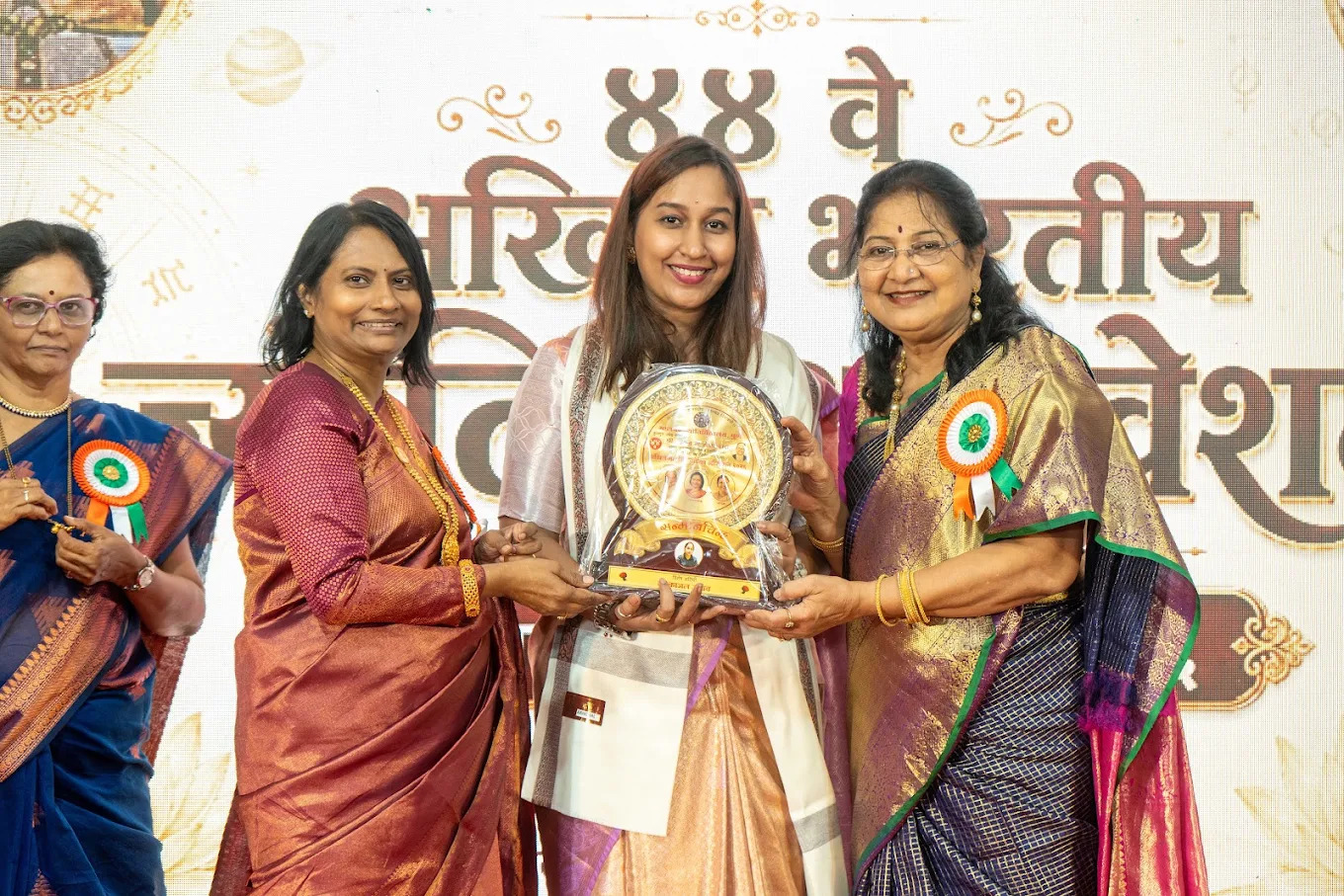Kaajjal receiving spiritual excellence recognition